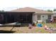 Home backyard featuring a screened-in porch with space for relaxation and entertaining at 10933 Subtle Trail Dr, Riverview, FL 33569
