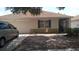 Charming single-story home with a tidy front yard, attached garage, and screened porch at 10933 Subtle Trail Dr, Riverview, FL 33569