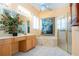 Bathroom featuring tiled floor, framed shower, soaking tub at 1115 Signature Dr, Sun City Center, FL 33573