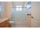 Bright bathroom with a combination shower and bathtub, plus a modern vanity at 1115 Signature Dr, Sun City Center, FL 33573
