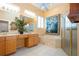 Bathroom featuring tiled floor, framed shower, soaking tub at 1115 Signature Dr, Sun City Center, FL 33573