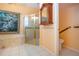 Bathroom featuring tiled floor, framed shower, soaking tub at 1115 Signature Dr, Sun City Center, FL 33573