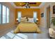 Sun-filled bedroom showcases a patterned bedspread and stylish furnishings, creating an inviting retreat at 1115 Signature Dr, Sun City Center, FL 33573