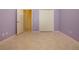 Bedroom with closet doors and neutral tile flooring throughout the space at 1115 Signature Dr, Sun City Center, FL 33573