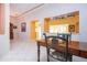 Spacious dining area with white tile floors and views into the kitchen and living room at 1115 Signature Dr, Sun City Center, FL 33573