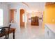 Open dining room featuring a hutch, and arched entryway providing architectural interest and natural light at 1115 Signature Dr, Sun City Center, FL 33573