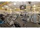 A well-equipped fitness center featuring state-of-the-art machines and TVs for an enjoyable exercise experience at 1115 Signature Dr, Sun City Center, FL 33573