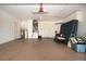 Spacious garage featuring epoxy floors, white walls, and overhead lighting at 1115 Signature Dr, Sun City Center, FL 33573
