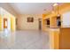 Bright living room with tile floors, neutral walls, and an open layout to kitchen and adjacent rooms at 1115 Signature Dr, Sun City Center, FL 33573