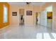 Spacious living room with tile flooring, neutral paint, and natural light throughout at 1115 Signature Dr, Sun City Center, FL 33573