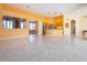 Bright living space with tile floors, kitchen, stainless appliances, and seamless flow for modern living at 1115 Signature Dr, Sun City Center, FL 33573