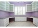 Bright home office space featuring built-in shelving and a spacious workspace at 1115 Signature Dr, Sun City Center, FL 33573