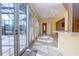 Sunroom with tile flooring, natural light, and outdoor access at 1115 Signature Dr, Sun City Center, FL 33573