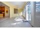 Sunroom with tile flooring, natural light, and outdoor access at 1115 Signature Dr, Sun City Center, FL 33573