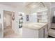 Elegant bar area with stone countertops, shelving for bottles, and space for glassware at 1123 Hounds Run, Safety Harbor, FL 34695