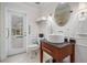 Bathroom with granite vanity, vessel sink, and access to pool at 1123 Hounds Run, Safety Harbor, FL 34695