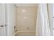 Simple bathroom featuring a standard tub/shower combo with tile surround and shower curtain at 1123 Hounds Run, Safety Harbor, FL 34695