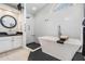 Bright bathroom featuring a soaking tub, walk-in shower, and vanity with a vessel sink at 1123 Hounds Run, Safety Harbor, FL 34695