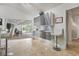 Bright kitchen with stainless steel cabinets and views of the patio and pool area through sliding glass doors at 1123 Hounds Run, Safety Harbor, FL 34695