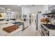 Bright kitchen with stainless steel appliances, including a gas range and a large sink under the counter at 1123 Hounds Run, Safety Harbor, FL 34695