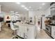 Open concept kitchen with stainless steel appliances and seating at breakfast bar at 1123 Hounds Run, Safety Harbor, FL 34695