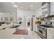 Bright, modern kitchen with stainless steel appliances and large sink at 1123 Hounds Run, Safety Harbor, FL 34695