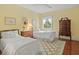 Comfortable bedroom featuring two beds, soft decor and a ceiling fan at 11806 Willow Point Way, Tampa, FL 33618