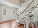 Foyer with a staircase, hardwood floors, and decorative wallpaper at 11806 Willow Point Way, Tampa, FL 33618