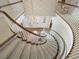 Overhead view of the grand foyer with winding staircase and hardwood floors at 11806 Willow Point Way, Tampa, FL 33618