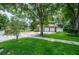 Beautiful home showcasing a three-car garage, well-maintained landscaping, and a spacious driveway at 11806 Willow Point Way, Tampa, FL 33618