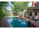 Beautiful pool area with brick patio, providing a perfect space for outdoor relaxation and entertaining at 11806 Willow Point Way, Tampa, FL 33618