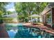 Beautiful backyard pool area with outdoor furniture, providing a perfect space for relaxation and entertaining at 11806 Willow Point Way, Tampa, FL 33618