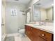 Bright bathroom with a modern vanity, a walk-in shower, and decorative coastal accents at 1208 E Kennedy Blvd # 1017, Tampa, FL 33602