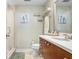 Bright bathroom featuring updated vanity, mirror, and glass enclosed shower at 1208 E Kennedy Blvd # 1017, Tampa, FL 33602