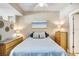 Comfortable bedroom with neutral tones, dresser, lamps and art at 1208 E Kennedy Blvd # 1017, Tampa, FL 33602