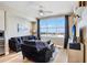 Living room featuring a ceiling fan, large windows, and comfortable seating at 1208 E Kennedy Blvd # 1017, Tampa, FL 33602