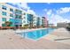 Relaxing outdoor swimming pool with comfortable seating and a view of the condo building at 1208 E Kennedy Blvd # 1017, Tampa, FL 33602