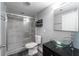 Modern bathroom features a glass shower and beautiful glass bowl sink at 1301 S Howard Ave # C10, Tampa, FL 33606