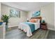 Cozy bedroom features a well-lit window and decorative wall art at 1301 S Howard Ave # C10, Tampa, FL 33606