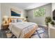 Comfortable bedroom features a decorative rug and bedside lighting at 1301 S Howard Ave # C10, Tampa, FL 33606