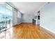 Spacious living room with hardwood floors and access to the outdoor patio at 1301 S Howard Ave # C10, Tampa, FL 33606