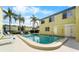 Enjoy community amenities, including a pool with ample lounge chairs at 1301 S Howard Ave # C10, Tampa, FL 33606