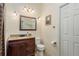 Elegant bathroom with granite vanity, warm lighting, and decorative fixtures at 1312 Gulf Rd, Tarpon Springs, FL 34689