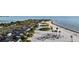 Expansive beach with vibrant palm trees, soft sand, and clear waters at 1312 Gulf Rd, Tarpon Springs, FL 34689
