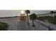 Picturesque beach scene featuring a lifeguard tower framed by palm trees against a backdrop of serene waters at 1312 Gulf Rd, Tarpon Springs, FL 34689