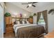 Bedroom featuring large bed, side tables, and natural light from the window at 1312 Gulf Rd, Tarpon Springs, FL 34689