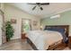 Comfortable bedroom with a ceiling fan, large windows, and a spacious layout at 1312 Gulf Rd, Tarpon Springs, FL 34689