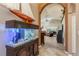 Inviting foyer with a large aquarium and arched entryway at 1312 Gulf Rd, Tarpon Springs, FL 34689