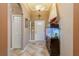 Beautiful foyer with tile flooring, archways, and an aquarium at 1312 Gulf Rd, Tarpon Springs, FL 34689