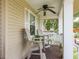 Relaxing front porch with ceiling fan and comfortable seating at 1312 Gulf Rd, Tarpon Springs, FL 34689